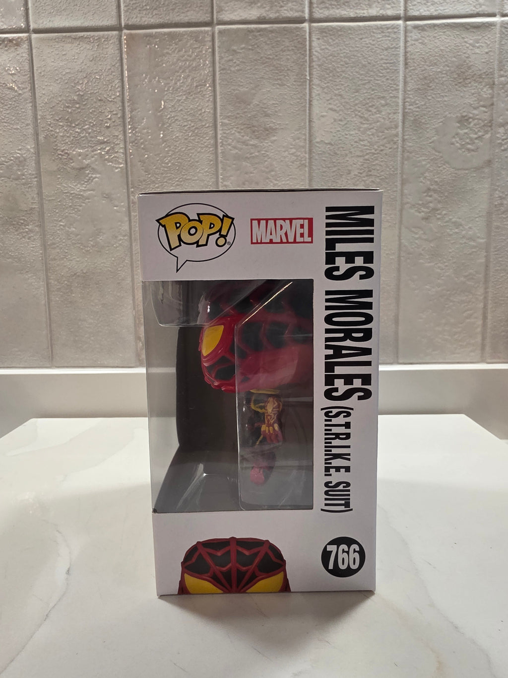 Funko Pop! Marvel Miles Morales (S.T.R.I.K.E. Suit) 766 (pre-owned) - Frog Vault Collectables
