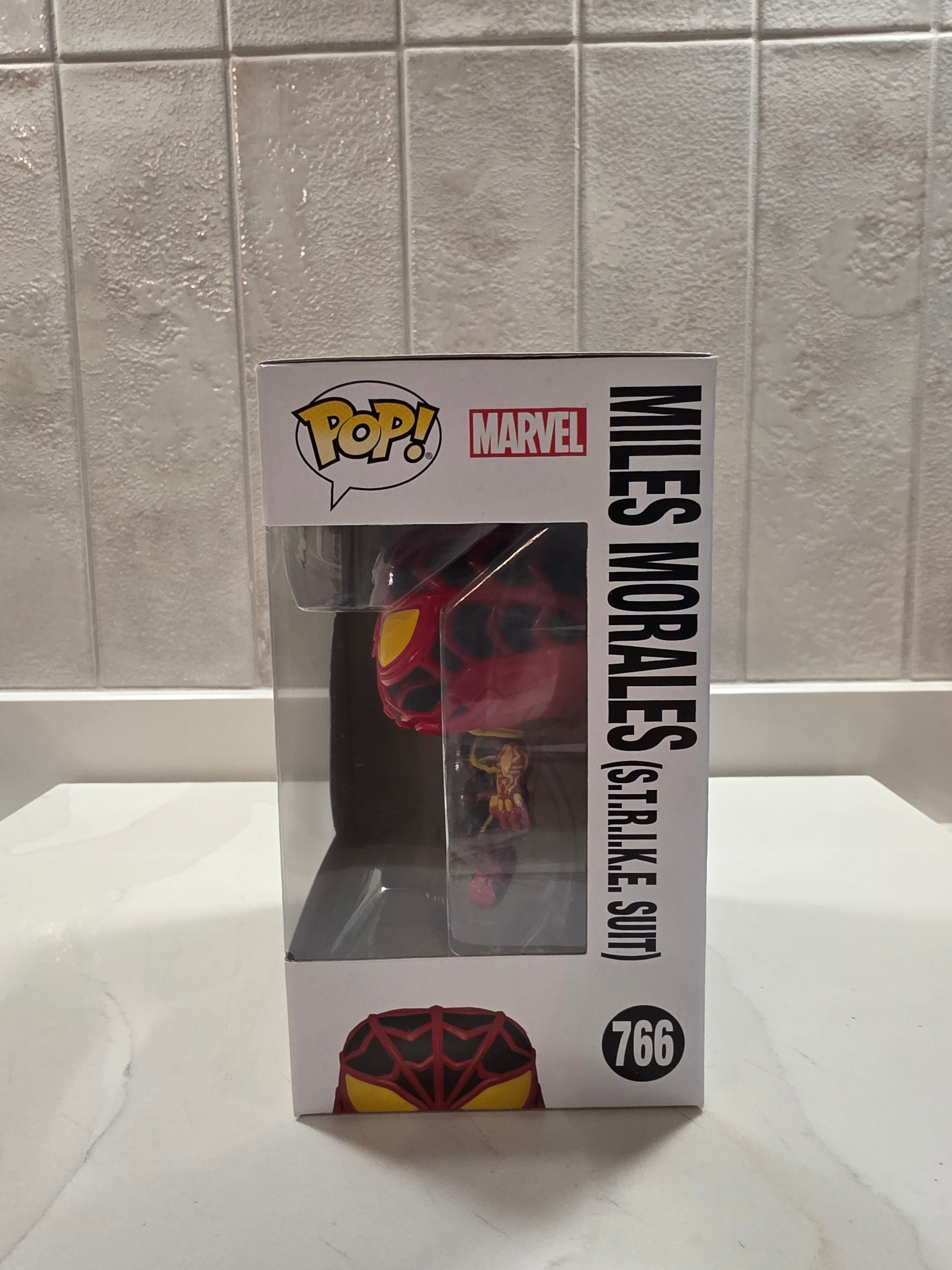 Funko Pop! Marvel Miles Morales (S.T.R.I.K.E. Suit) 766 (pre-owned) - Frog Vault Collectables