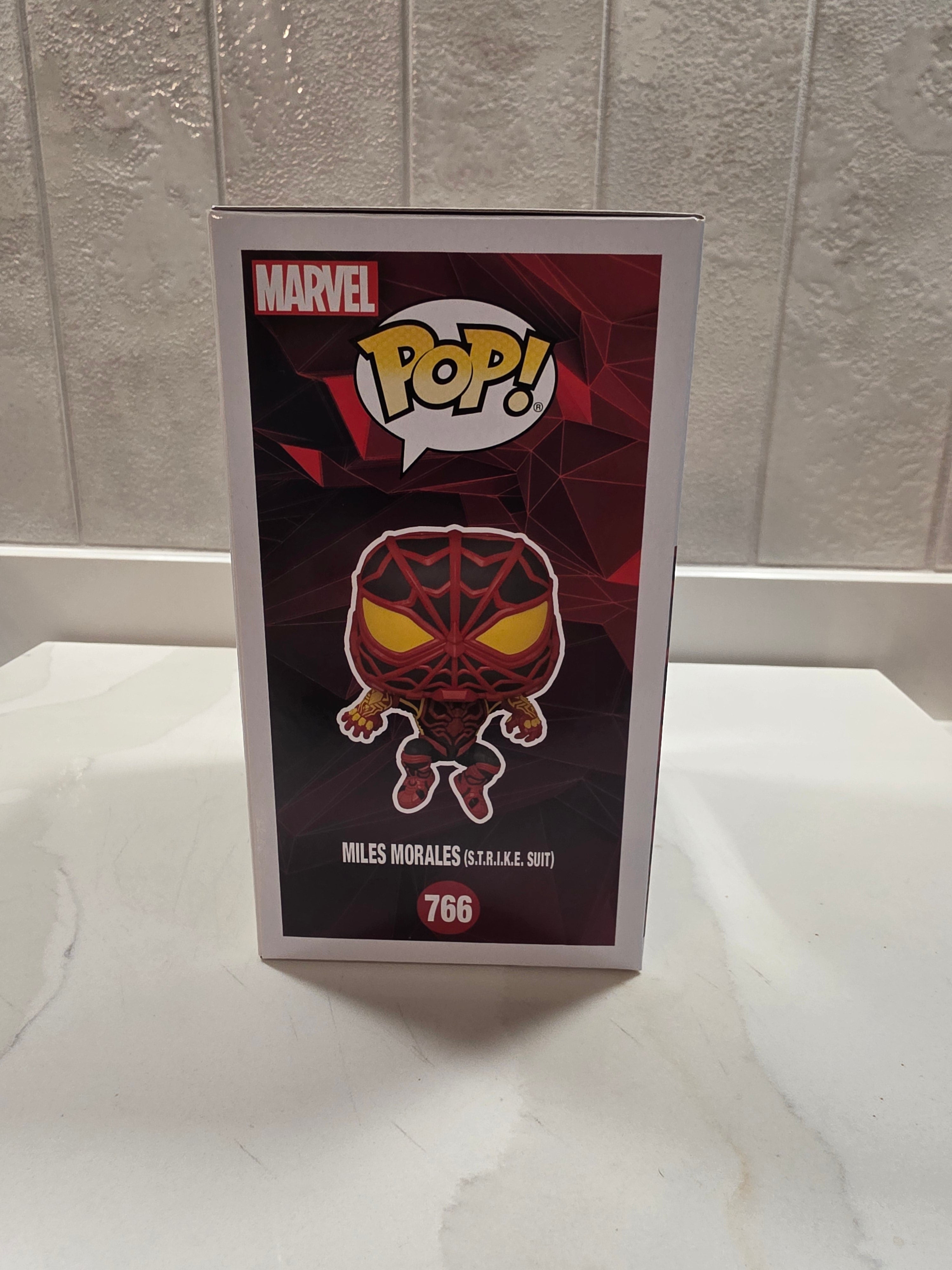 Funko Pop! Marvel Miles Morales (S.T.R.I.K.E. Suit) 766 (pre-owned) - Frog Vault Collectables