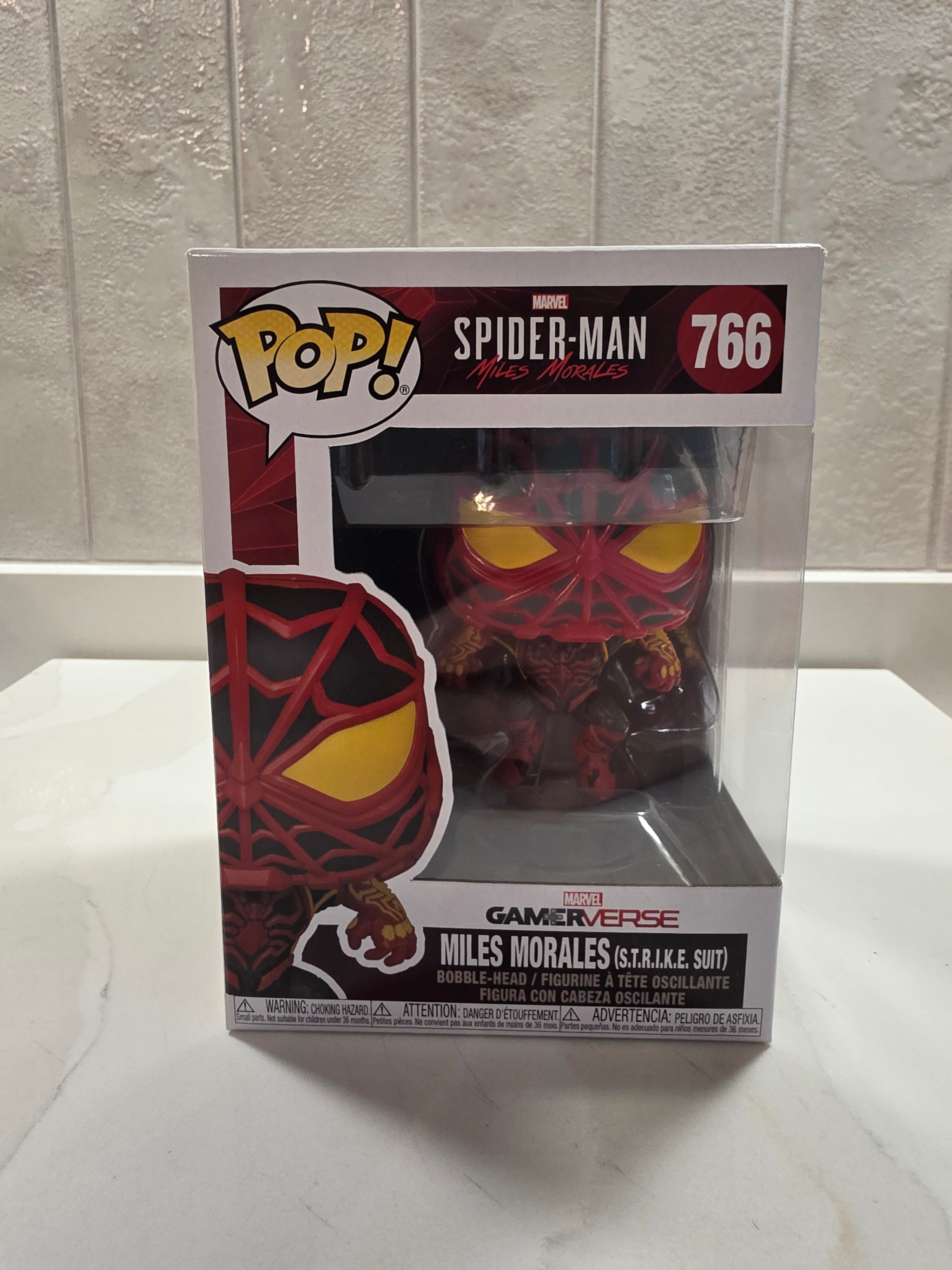 Funko Pop! Marvel Miles Morales (S.T.R.I.K.E. Suit) 766 (pre-owned) - Frog Vault Collectables