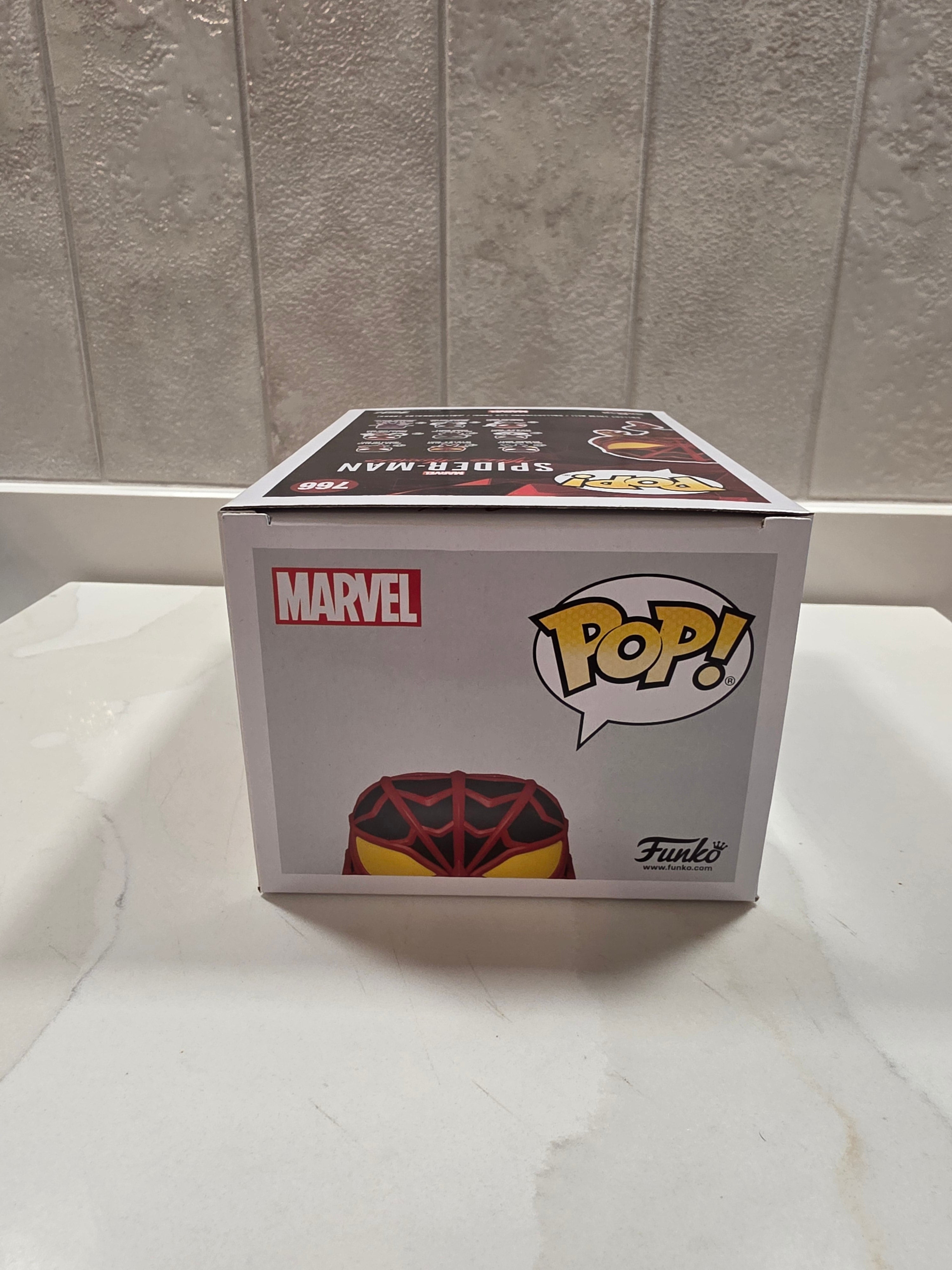 Funko Pop! Marvel Miles Morales (S.T.R.I.K.E. Suit) 766 (pre-owned) - Frog Vault Collectables