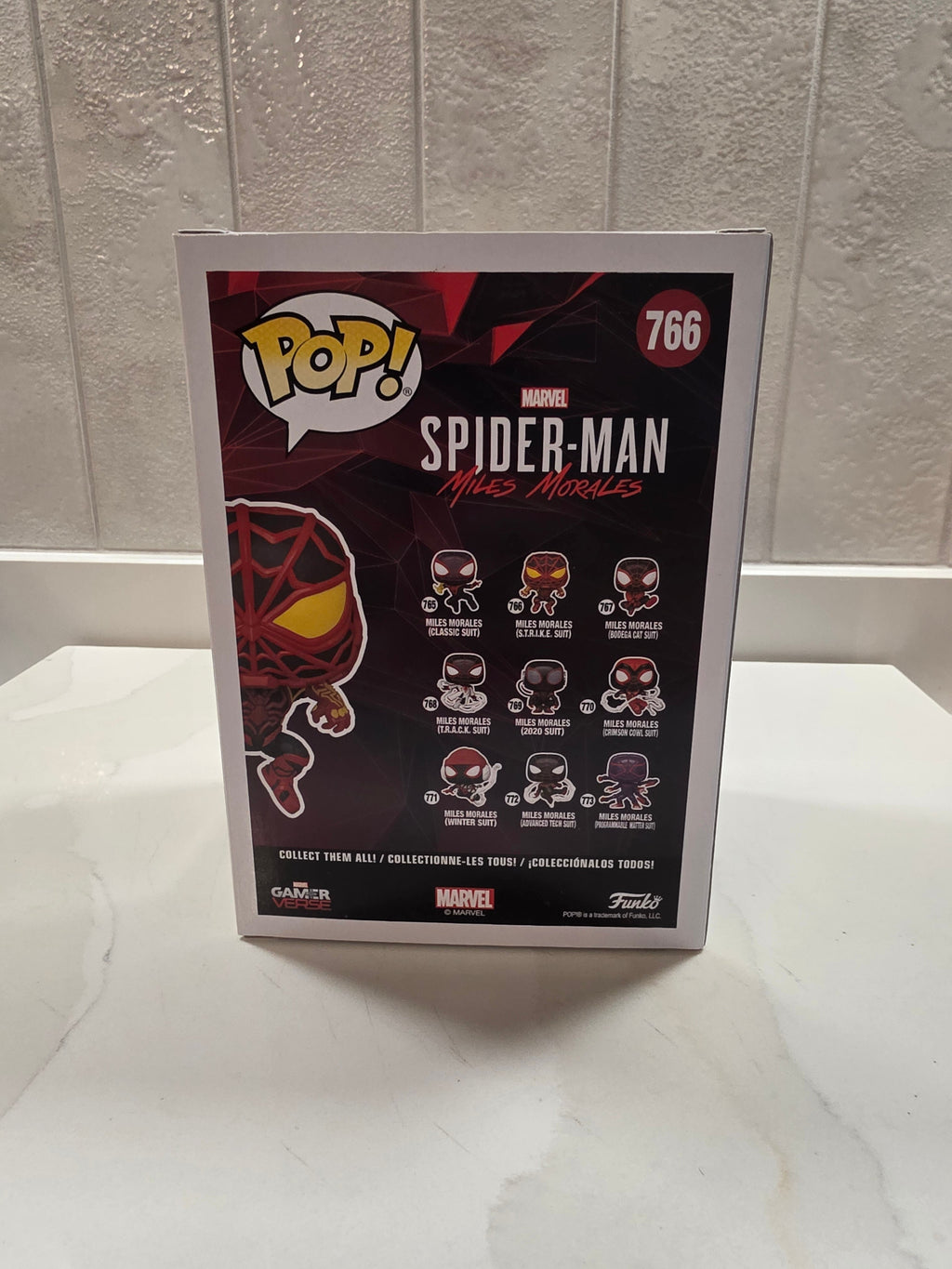 Funko Pop! Marvel Miles Morales (S.T.R.I.K.E. Suit) 766 (pre-owned) - Frog Vault Collectables