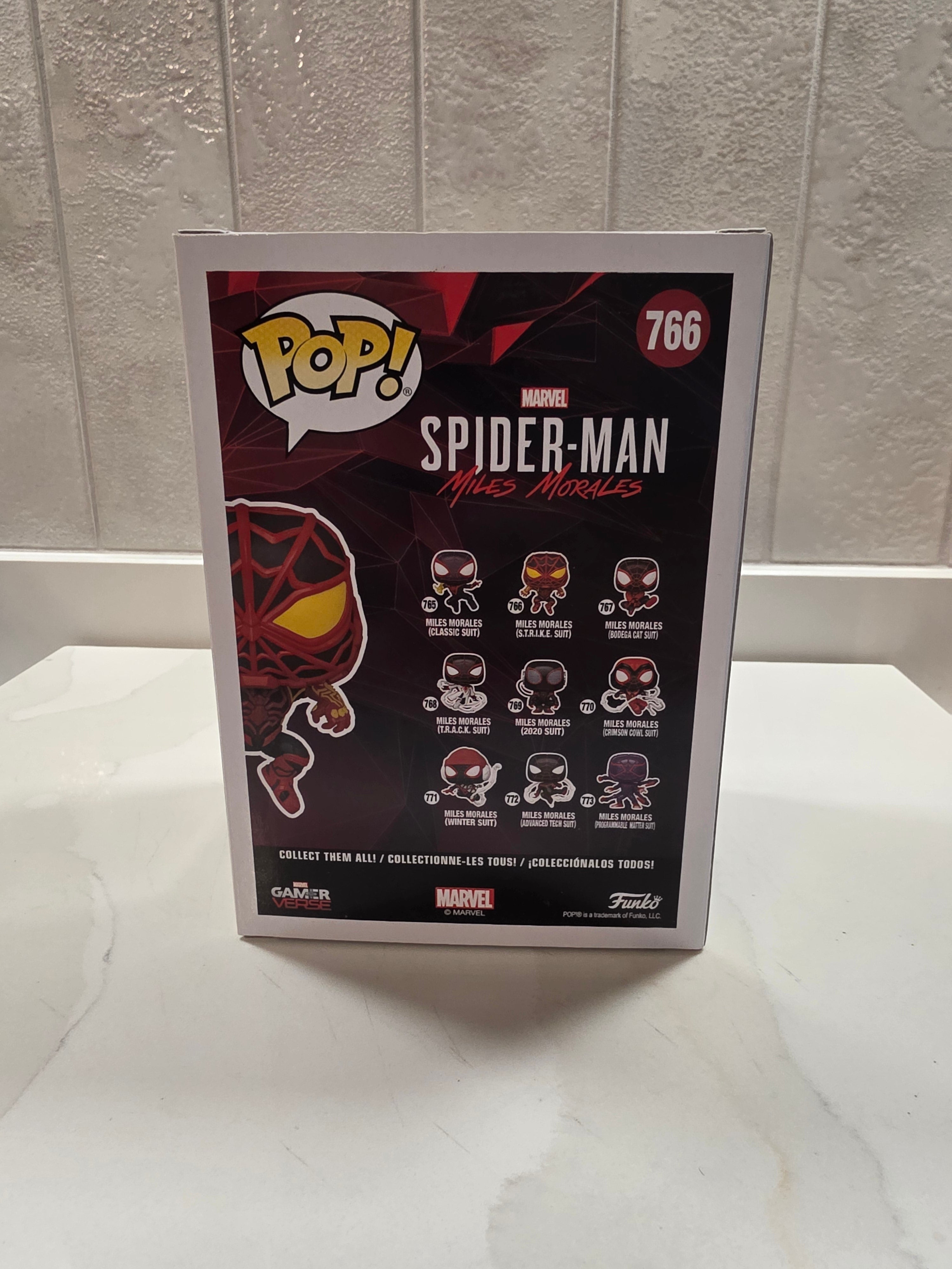 Funko Pop! Marvel Miles Morales (S.T.R.I.K.E. Suit) 766 (pre-owned) - Frog Vault Collectables
